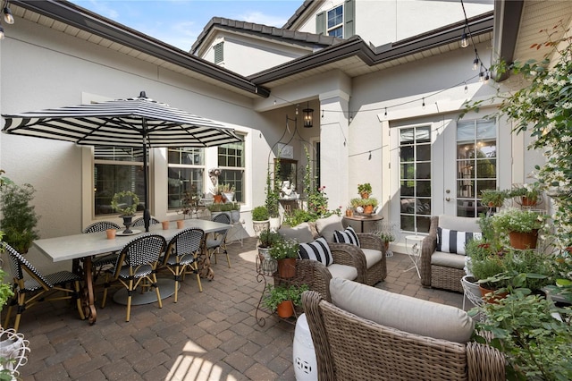 view of patio / terrace with an outdoor hangout area, outdoor dining area, and french doors