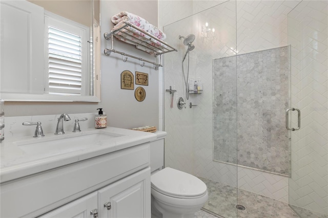 full bath with toilet, a shower stall, and vanity