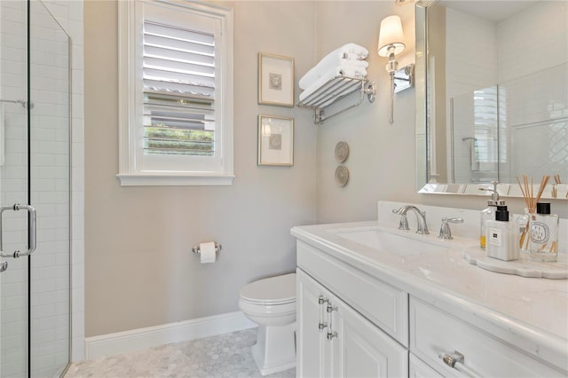 bathroom with baseboards, tile patterned floors, vanity, toilet, and tiled shower