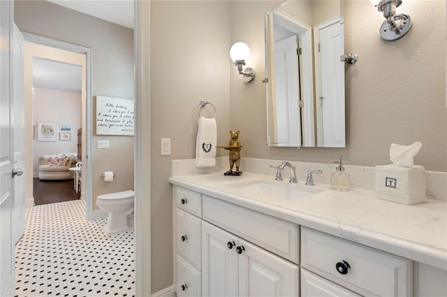 bathroom with vanity and toilet