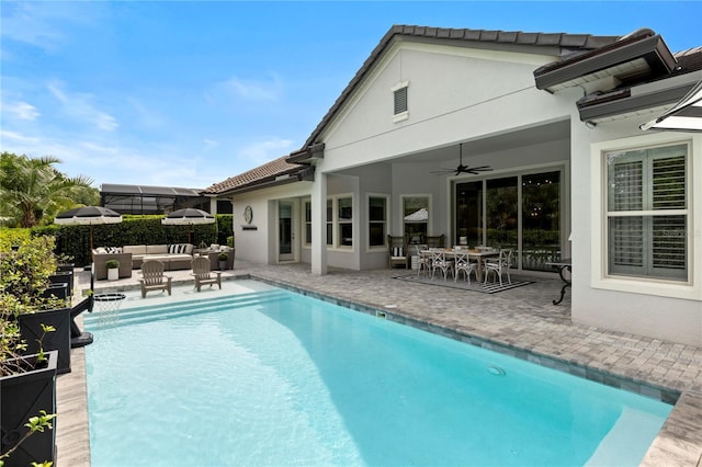 view of pool featuring an outdoor hangout area, a ceiling fan, a fenced in pool, and a patio