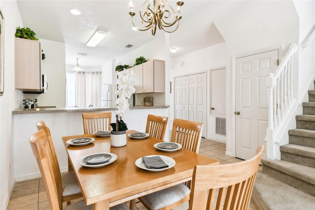 1180 S Beach Cir, Kissimmee, FL 34746 - dining space with a chandelier, stairs, and light tile patterned floors