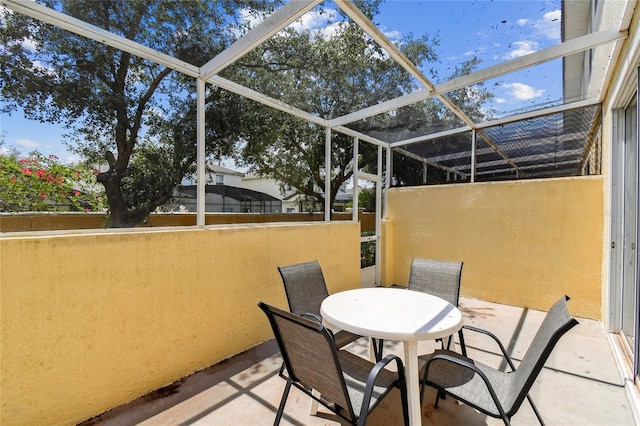 1180 S Beach Cir, Kissimmee, FL 34746 - view of patio / terrace with glass enclosure and outdoor dining space