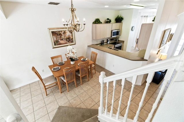 1180 S Beach Cir, Kissimmee, FL 34746 - dining area with a chandelier and light tile patterned floors