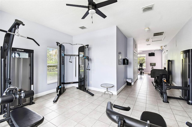1180 S Beach Cir, Kissimmee, FL 34746 - exercise area with a ceiling fan, light tile patterned floors, and baseboards