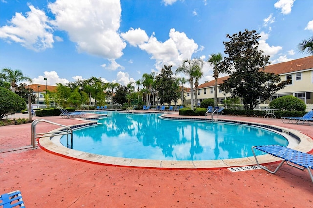 1180 S Beach Cir, Kissimmee, FL 34746 - community pool featuring a patio area