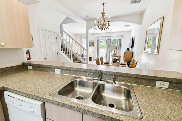 1180 S Beach Cir, Kissimmee, FL 34746 - kitchen featuring dishwasher, a sink, arched walkways, a chandelier, and hanging light fixtures