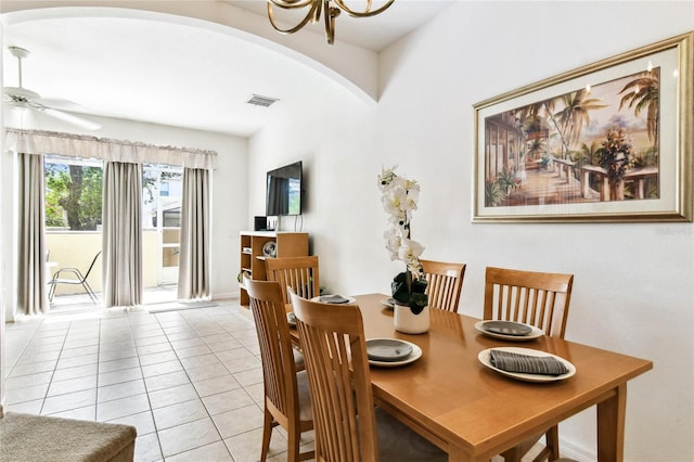 1180 S Beach Cir, Kissimmee, FL 34746 - dining space featuring arched walkways, a chandelier, light tile patterned floors, and ceiling fan