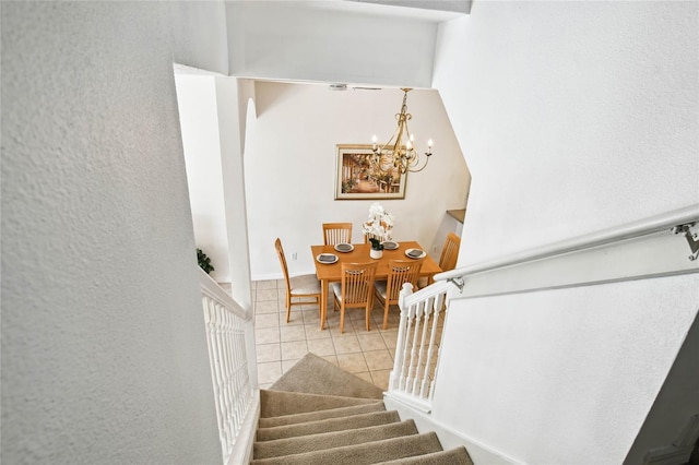 1180 S Beach Cir, Kissimmee, FL 34746 - staircase with tile patterned floors and a chandelier
