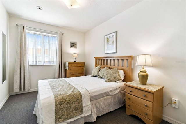 1180 S Beach Cir, Kissimmee, FL 34746 - bedroom featuring dark carpet and baseboards