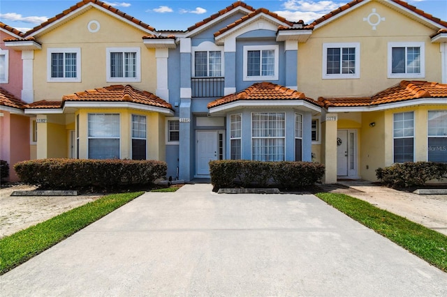 1180 S Beach Cir, Kissimmee, FL 34746 - multi unit property with a tile roof and stucco siding