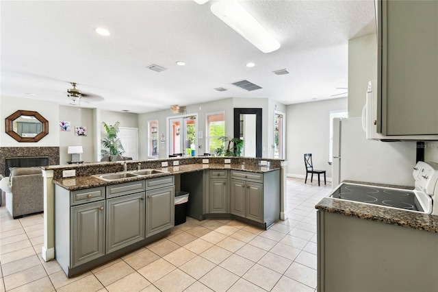 1180 S Beach Cir, Kissimmee, FL 34746 - kitchen featuring electric range, a sink, gray cabinets, light tile patterned floors, and recessed lighting