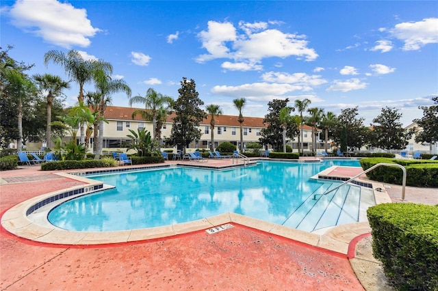 1180 S Beach Cir, Kissimmee, FL 34746 - community pool featuring a patio and a residential view
