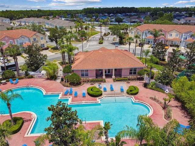 1180 S Beach Cir, Kissimmee, FL 34746 - community pool featuring a residential view and a patio