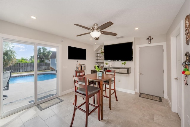 dining area with baseboards, ceiling fan, and recessed lighting