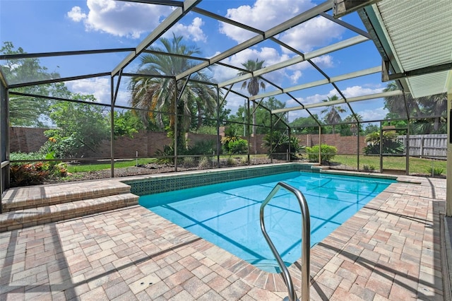 view of swimming pool with a fenced in pool, a fenced backyard, and a patio