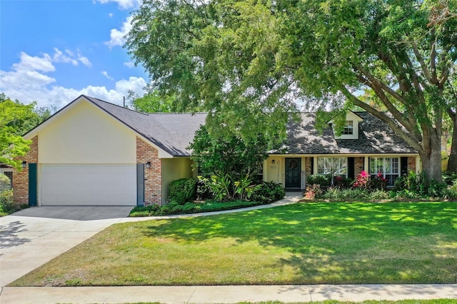 view of front facade with a garage, a front yard, brick siding, a shingled roof, and driveway