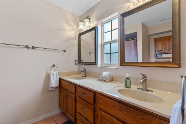 full bath featuring tile patterned flooring, a sink, double vanity, and visible vents