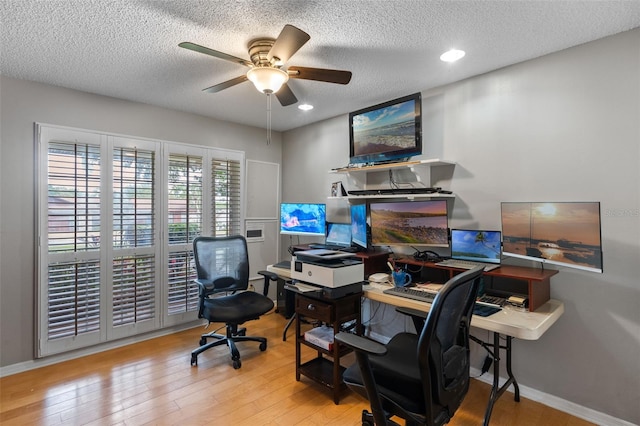 office with a ceiling fan, a textured ceiling, recessed lighting, and wood finished floors