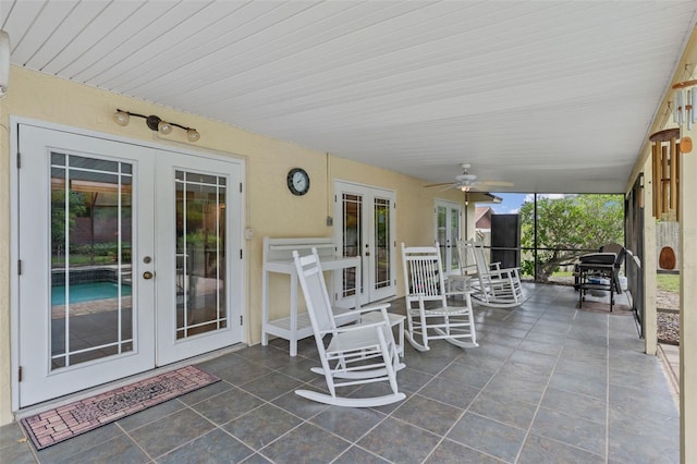 view of patio featuring a ceiling fan and french doors