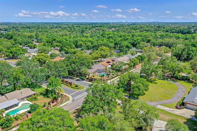 aerial view featuring a wooded view