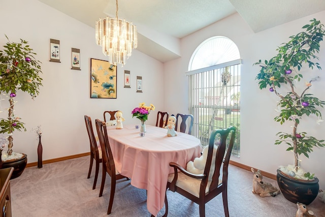 2712 Rolling Broak Dr, Orlando, FL 32837 - carpeted dining room featuring baseboards, lofted ceiling, and a notable chandelier