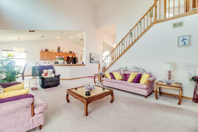 2712 Rolling Broak Dr, Orlando, FL 32837 - living area featuring a notable chandelier, light colored carpet, high vaulted ceiling, stairs, and visible vents