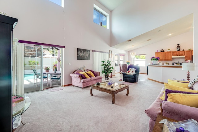2712 Rolling Broak Dr, Orlando, FL 32837 - living area with light colored carpet, baseboards, visible vents, and high vaulted ceiling