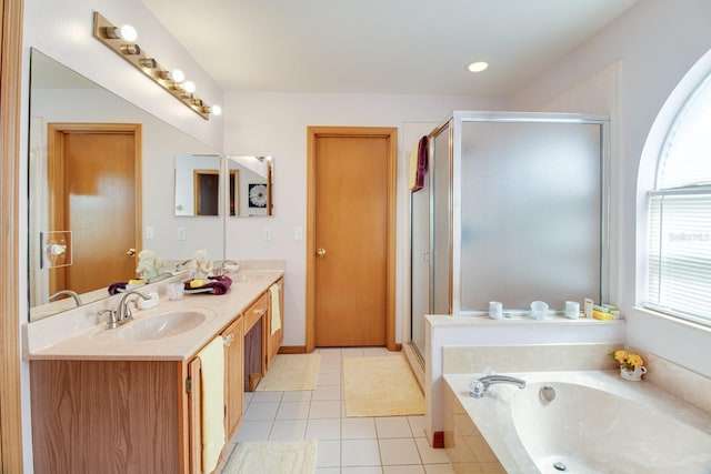 2712 Rolling Broak Dr, Orlando, FL 32837 - full bathroom featuring tile patterned flooring, double vanity, a bath, a sink, and a stall shower