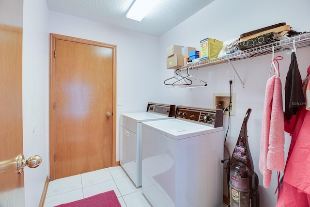 2712 Rolling Broak Dr, Orlando, FL 32837 - clothes washing area with a textured ceiling, laundry area, light tile patterned flooring, and washer and dryer