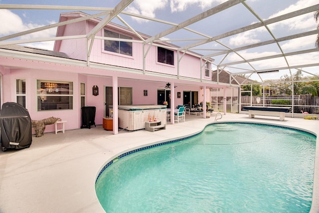 2712 Rolling Broak Dr, Orlando, FL 32837 - view of pool featuring ceiling fan, a fenced in pool, a patio area, glass enclosure, and a hot tub
