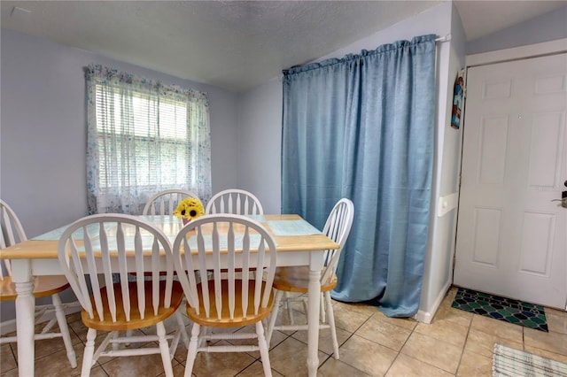 dining area with light tile patterned floors