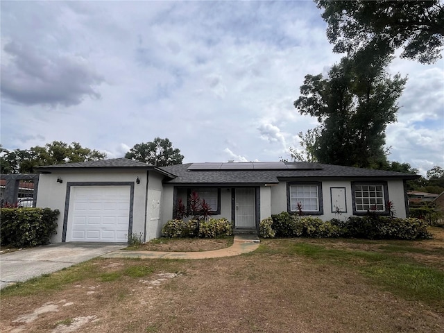 7028 Clarcona Ocoee Rd, Orlando, FL 32818 - single story home featuring driveway, an attached garage, stucco siding, a front yard, and roof mounted solar panels