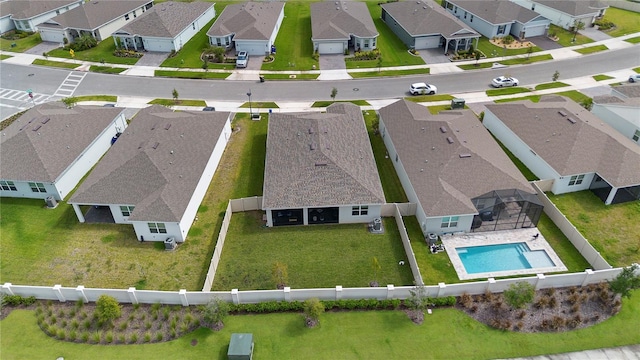 birds eye view of property with a residential view
