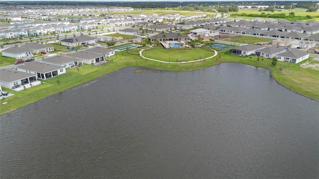 bird's eye view featuring a water view and a residential view