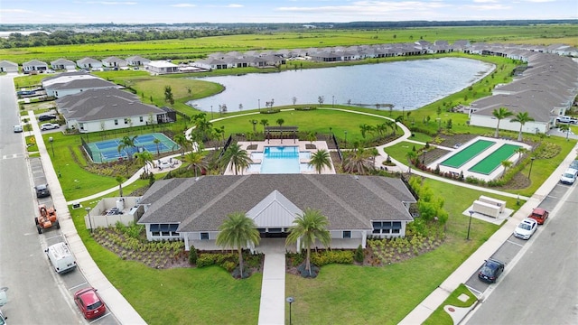 bird's eye view featuring a water view and a residential view