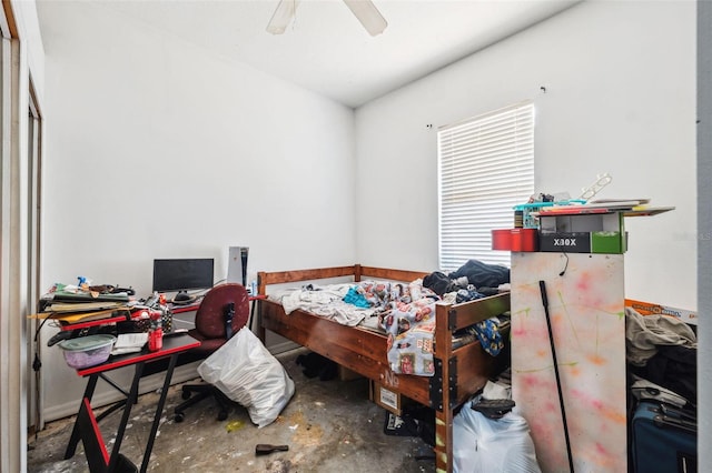 bedroom with ceiling fan and concrete floors
