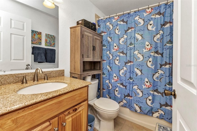 full bathroom featuring tile patterned floors, toilet, vanity, and shower / bath combo with shower curtain