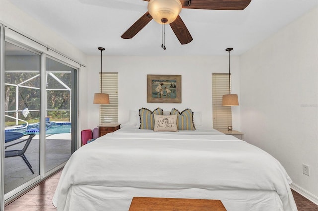 bedroom featuring access to outside, wood finished floors, baseboards, ceiling fan, and a sunroom
