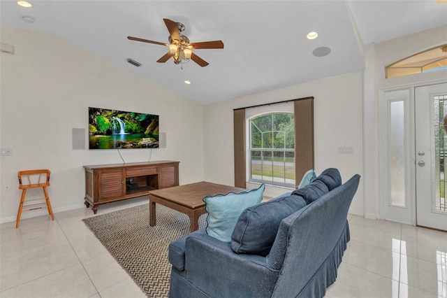 living area featuring lofted ceiling, light tile patterned flooring, a ceiling fan, recessed lighting, and baseboards