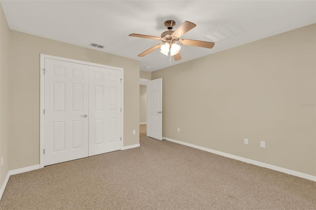 26807 Bull Run, Leesburg, FL 34748 - unfurnished bedroom featuring carpet, a closet, baseboards, and a ceiling fan