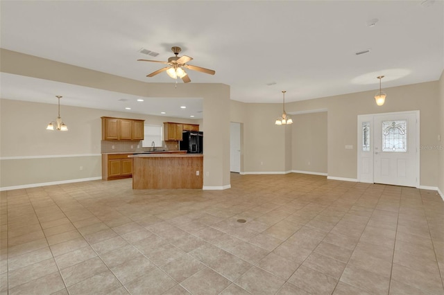 26807 Bull Run, Leesburg, FL 34748 - unfurnished living room featuring a chandelier, light tile patterned flooring, ceiling fan, and recessed lighting
