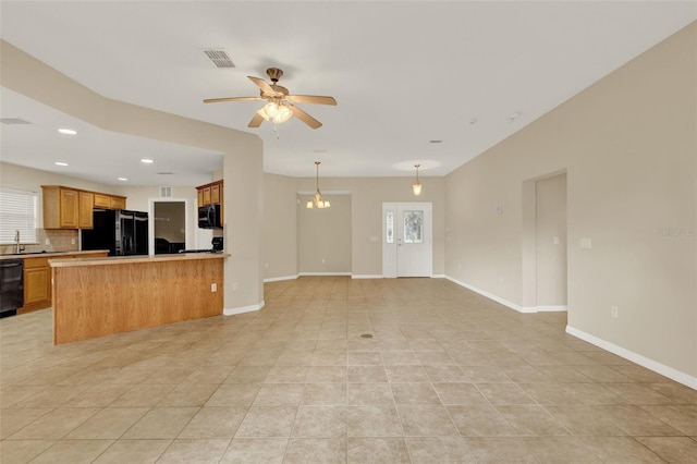 26807 Bull Run, Leesburg, FL 34748 - unfurnished living room featuring light tile patterned floors, ceiling fan, baseboards, a sink, and recessed lighting