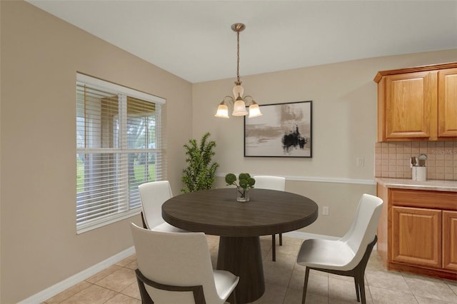 26807 Bull Run, Leesburg, FL 34748 - dining space with a chandelier, light tile patterned floors, and baseboards