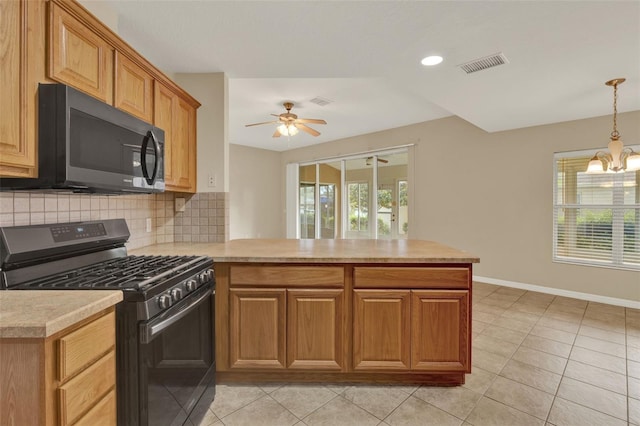 26807 Bull Run, Leesburg, FL 34748 - kitchen featuring appliances with stainless steel finishes, a peninsula, light countertops, decorative backsplash, and plenty of natural light