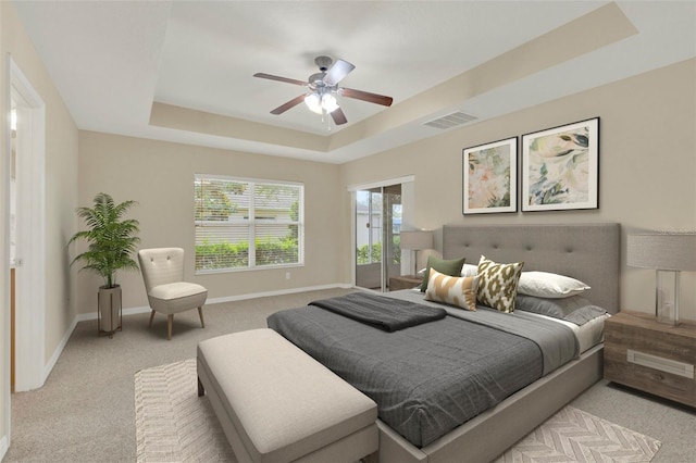 26807 Bull Run, Leesburg, FL 34748 - bedroom featuring a raised ceiling, light colored carpet, baseboards, and ceiling fan