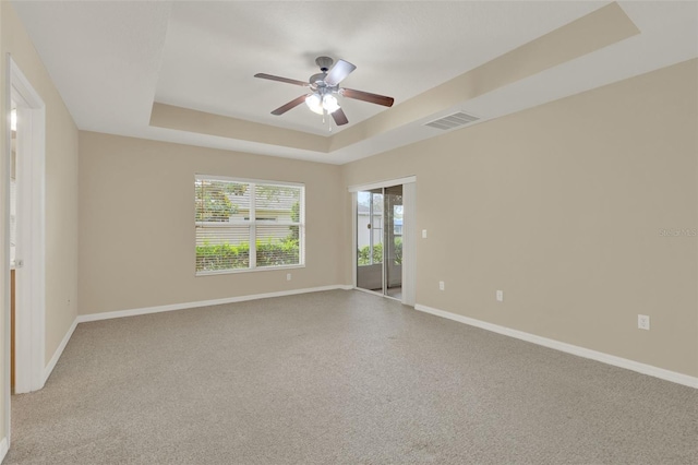26807 Bull Run, Leesburg, FL 34748 - carpeted spare room with a raised ceiling, ceiling fan, and baseboards