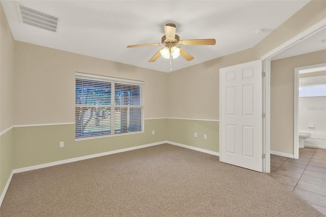 26807 Bull Run, Leesburg, FL 34748 - unfurnished bedroom with baseboards, carpet floors, and ceiling fan