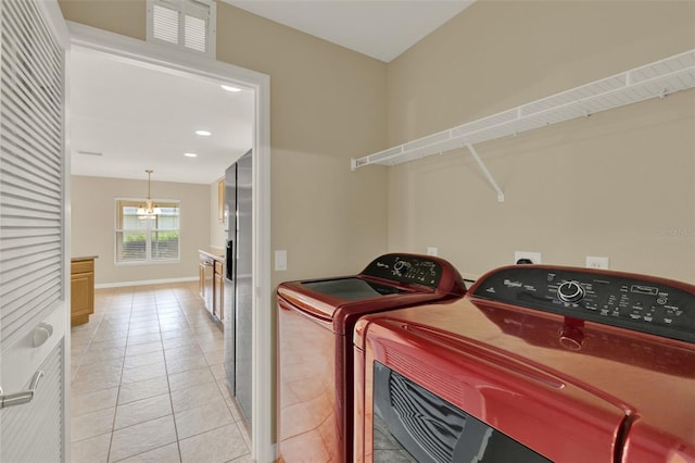 26807 Bull Run, Leesburg, FL 34748 - clothes washing area featuring a chandelier, washer and dryer, light tile patterned floors, baseboards, and recessed lighting