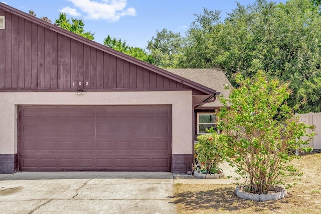 exterior space featuring concrete driveway